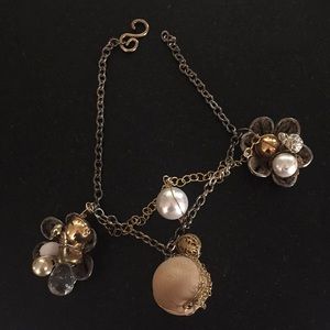 Designer necklace with wild charms